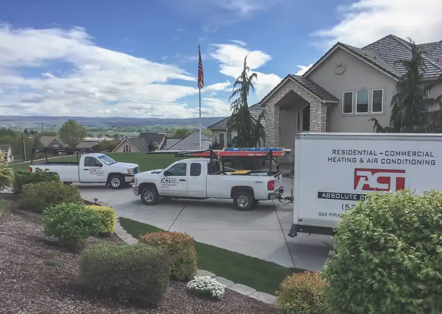 ACT trucks at a hillside custom home with a valley view