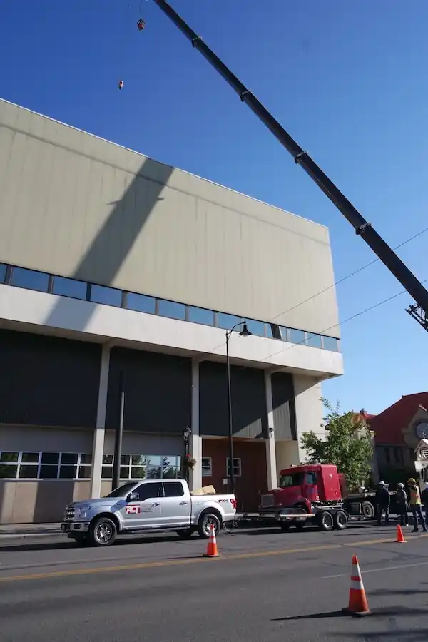 The Downtown YMCA wall with a crane boom rising beside it